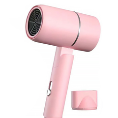 Foldable travel hair dryer in pink with its concentrator nozzle