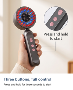 Close-up of the three control buttons on the scalp massager handle