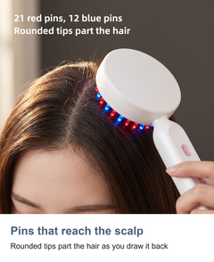 The lit LED pins of the scalp massager parting the hair against the scalp