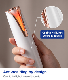 Close up of a hand holding the automatic curling iron with a zoom circle and label showing the outer body stays cool while the tube heats