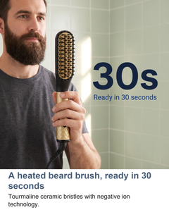 Man using the heated beard straightening brush in a bathroom mirror, ready in 30 seconds