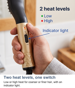Close up of the slide switch and indicator light on the heated beard straightening brush