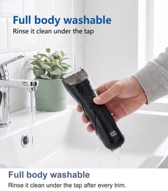 Body trimmer being rinsed clean under a running tap