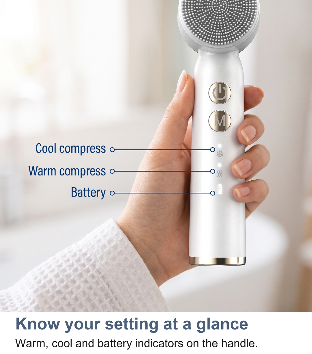 Macro of the warm, cool and battery indicators on the facial cleansing brush handle