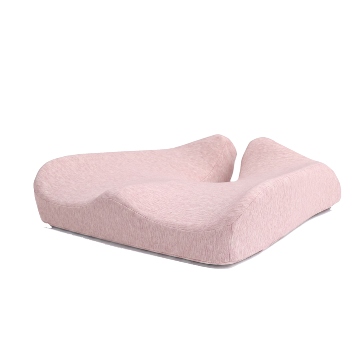 Pink memory foam coccyx cushion with U shaped tailbone cutout