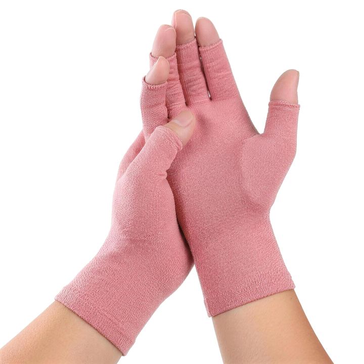 Open fingertip compression gloves in dusty pink worn on both hands
