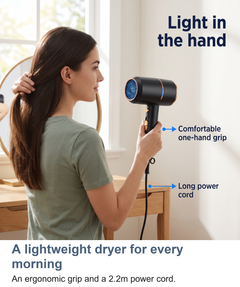 Woman using the lightweight ionic hair dryer with its 2.2m power cord