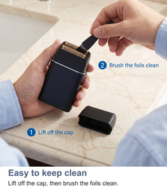 Two steps to clean the foil shaver: lift off the cap, brush the foils clean