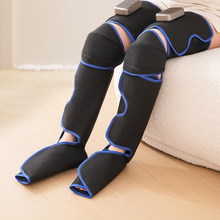 Foot and leg massager worn from the thigh to the open toe foot pocket