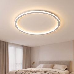 White thin ring LED ceiling light on a bedroom ceiling