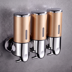 Gold wall mounted soap dispenser with chrome finish