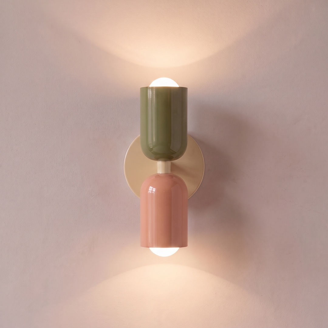 Green and salmon two tone capsule wall light shining up and down, lit