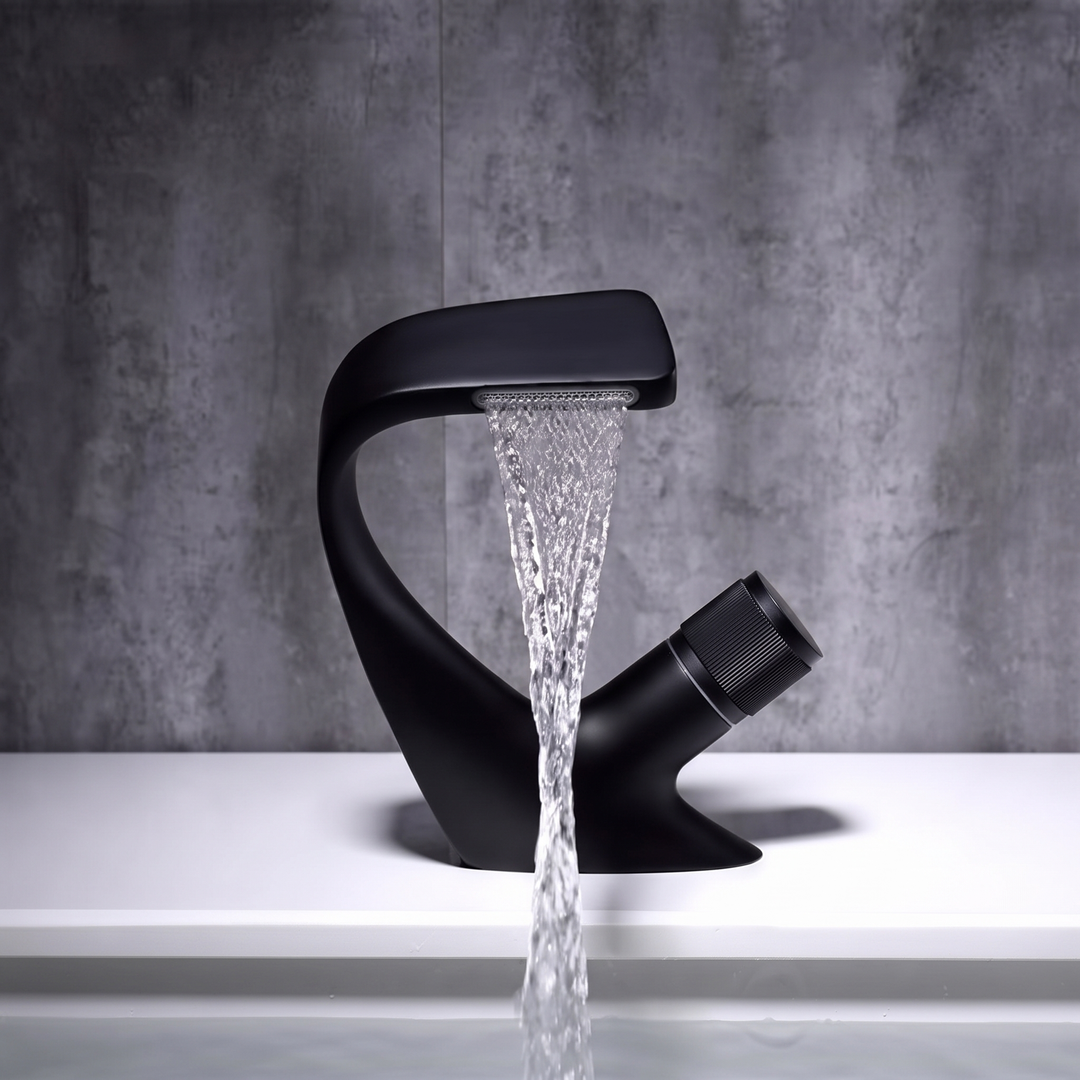 Matt Black curved waterfall basin mixer tap pouring a flat sheet of water