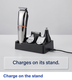 Trimmer and heads seated on the charging stand with a cable