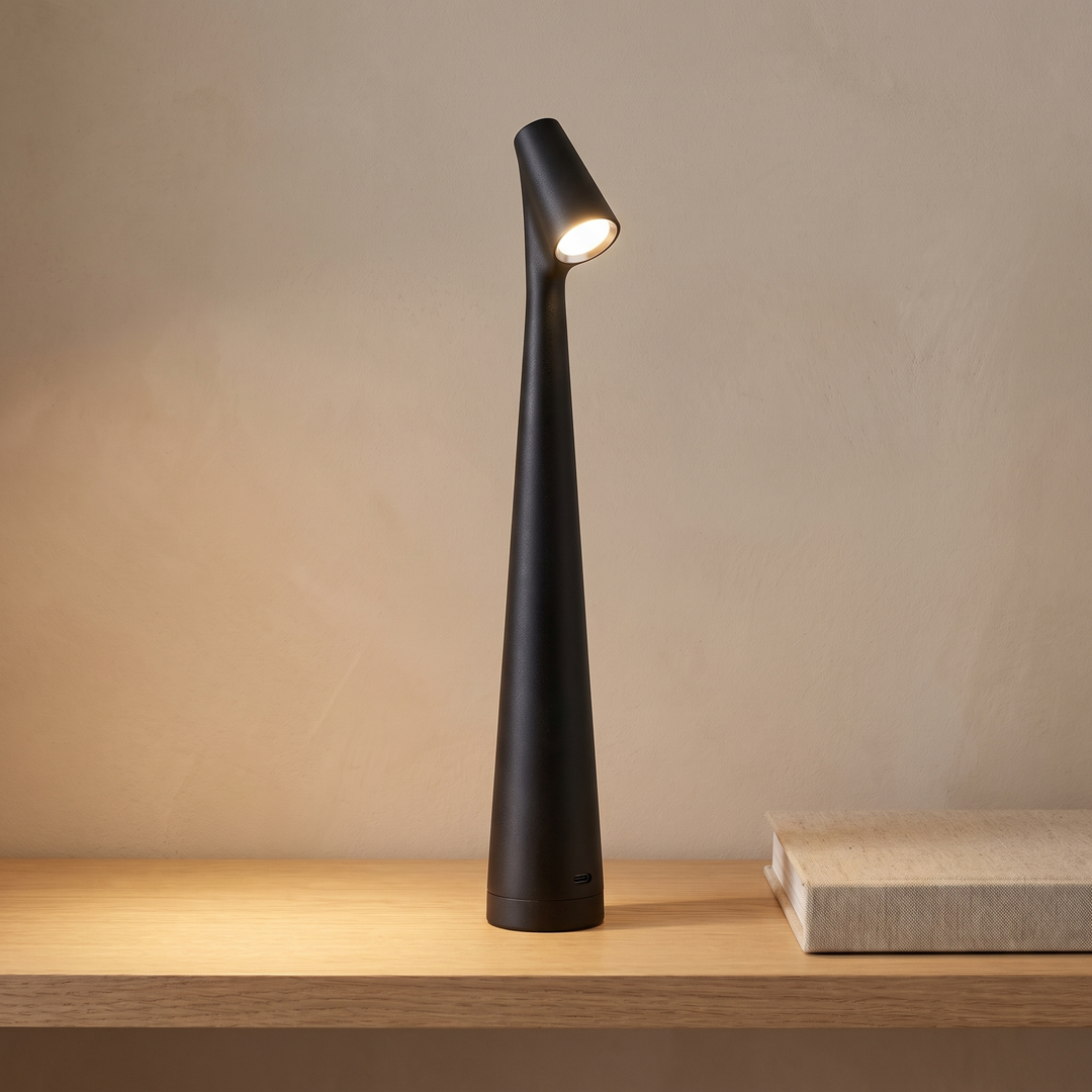 Black cordless rechargeable table lamp on a console table