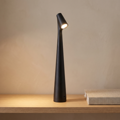 Black cordless rechargeable table lamp on a console table