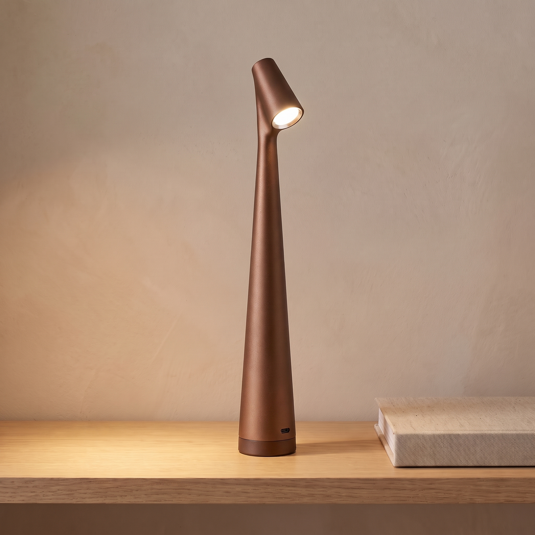 Brown cordless rechargeable table lamp on a console table