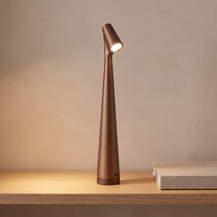 Brown cordless rechargeable table lamp on a console table