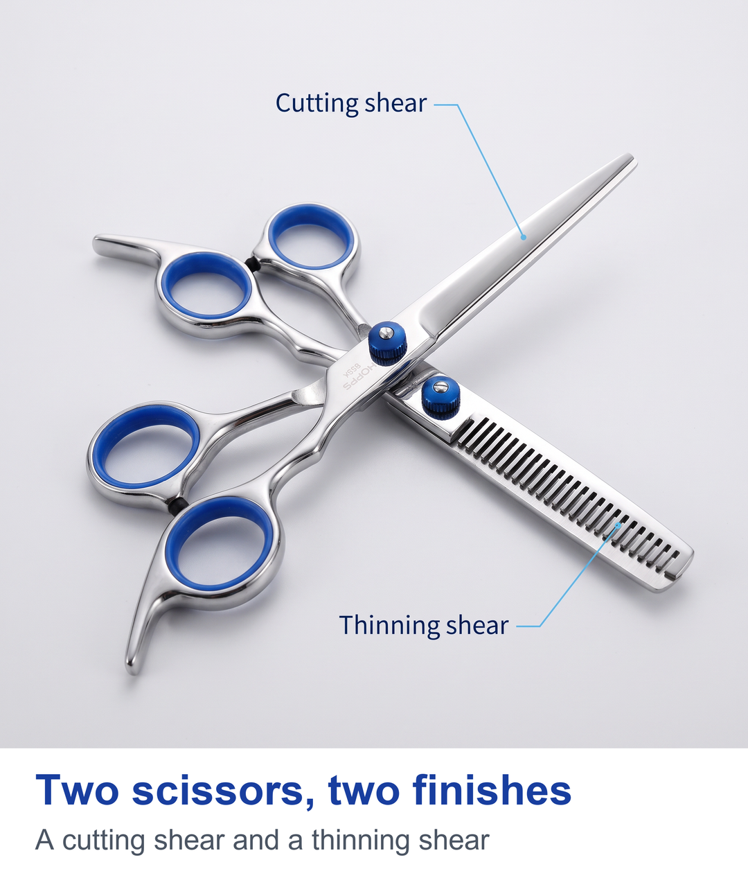 Two barber scissors crossed, a cutting shear and a thinning shear
