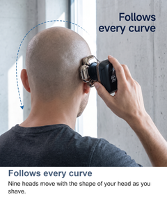 Man shaving the back of his head with the nine-head rotary shaver