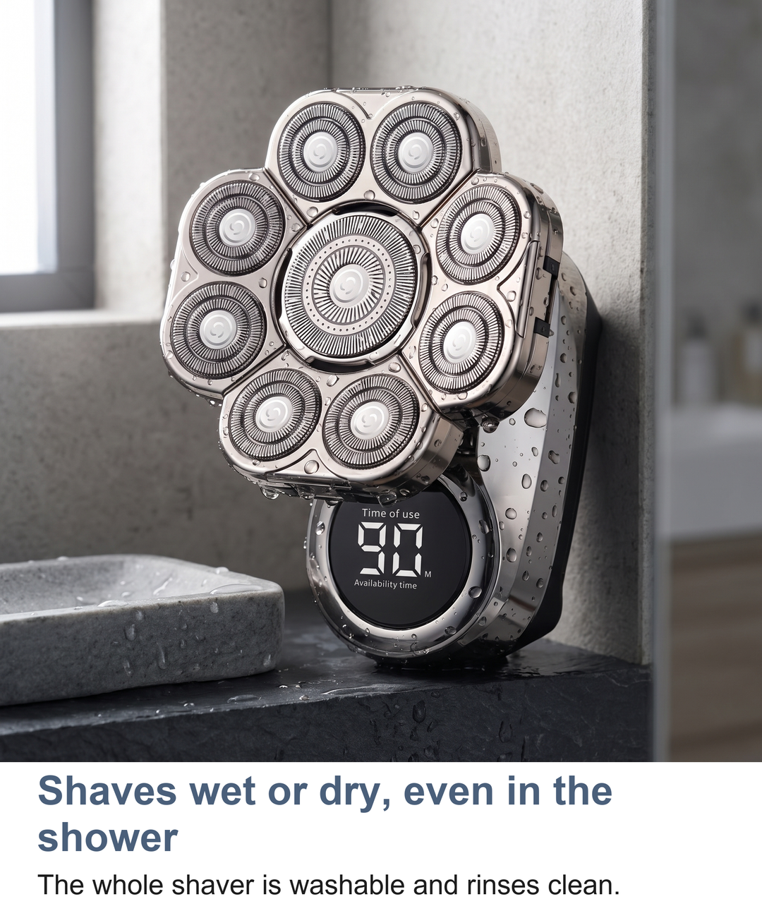 Rotary shaver standing in a shower niche, showing it can be used wet