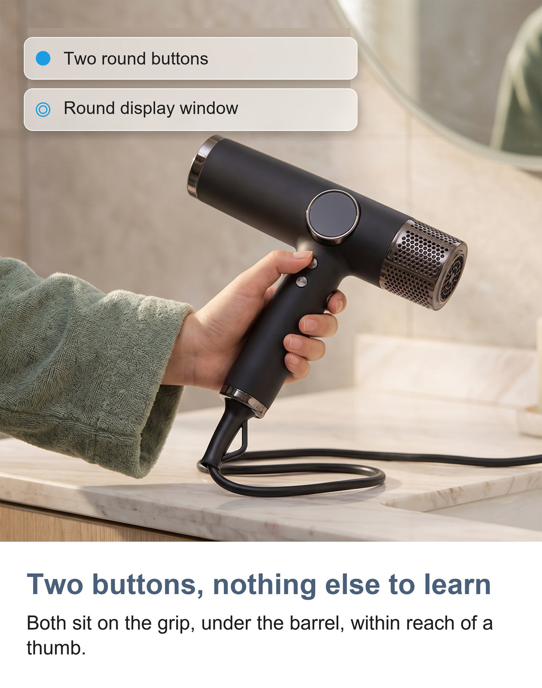 Close-up of the two round control buttons on the grip of the hair dryer