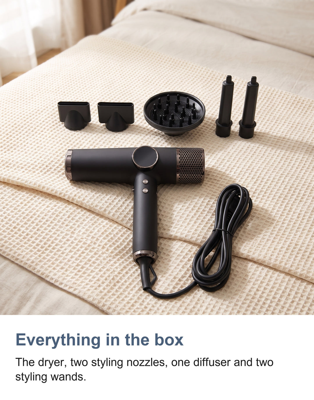 What is in the box: the hair dryer, two styling nozzles, one diffuser and two styling wands
