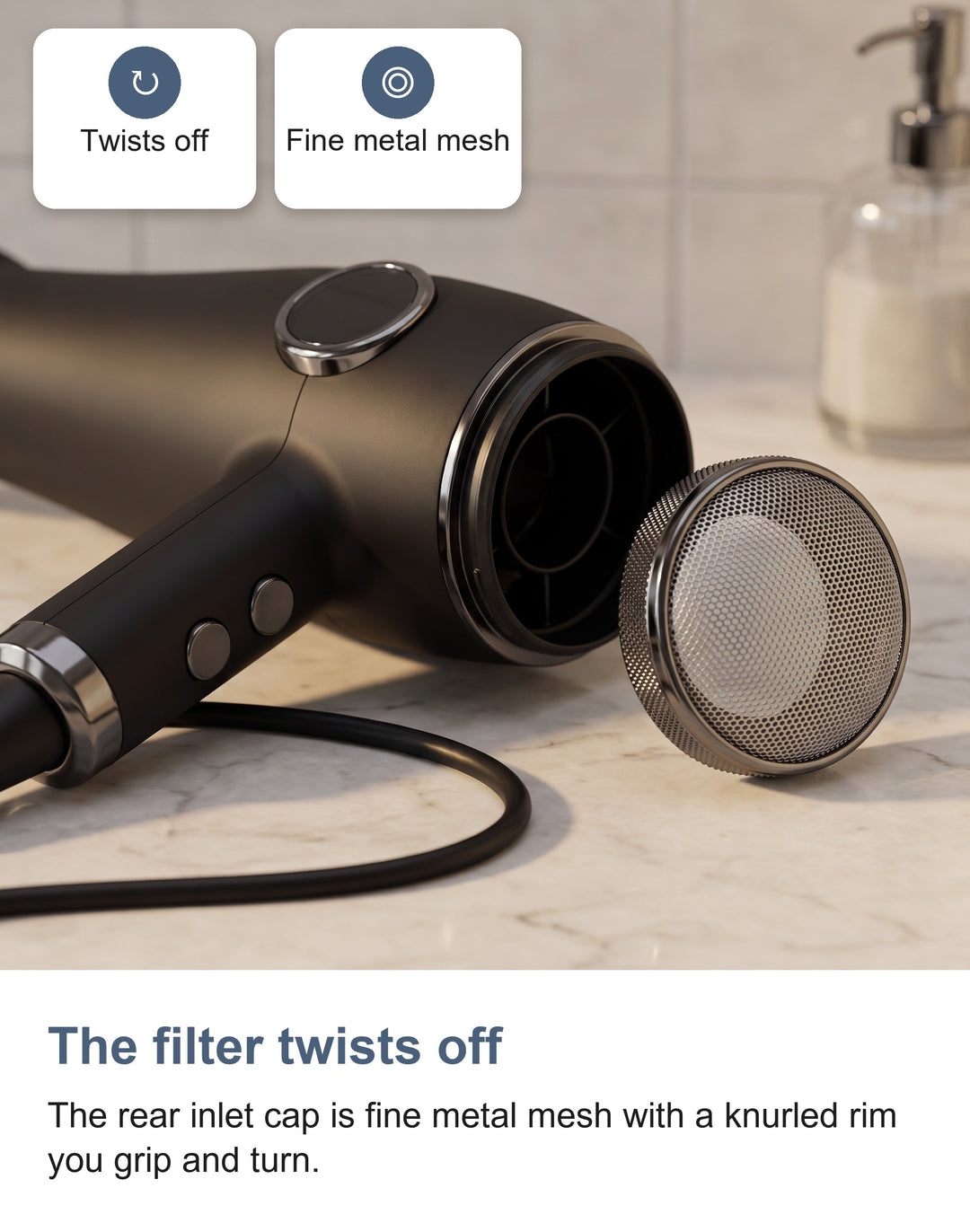 The removable mesh inlet cap twisted off the rear of the hair dryer barrel