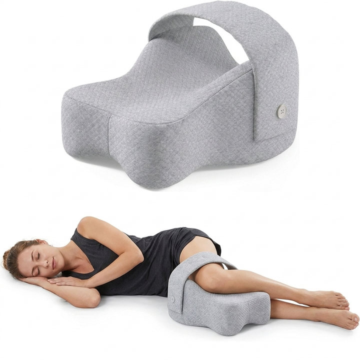 Knee pillow with adjustable strap shown and in use