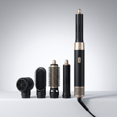 5 in 1 air curler and hot air styler in black and gold with its five interchangeable heads