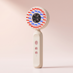 Electric scalp massager in white with the red and blue LED ring lit