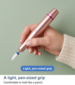 A hand holding the nail drill like a pencil, showing its light pen-sized grip