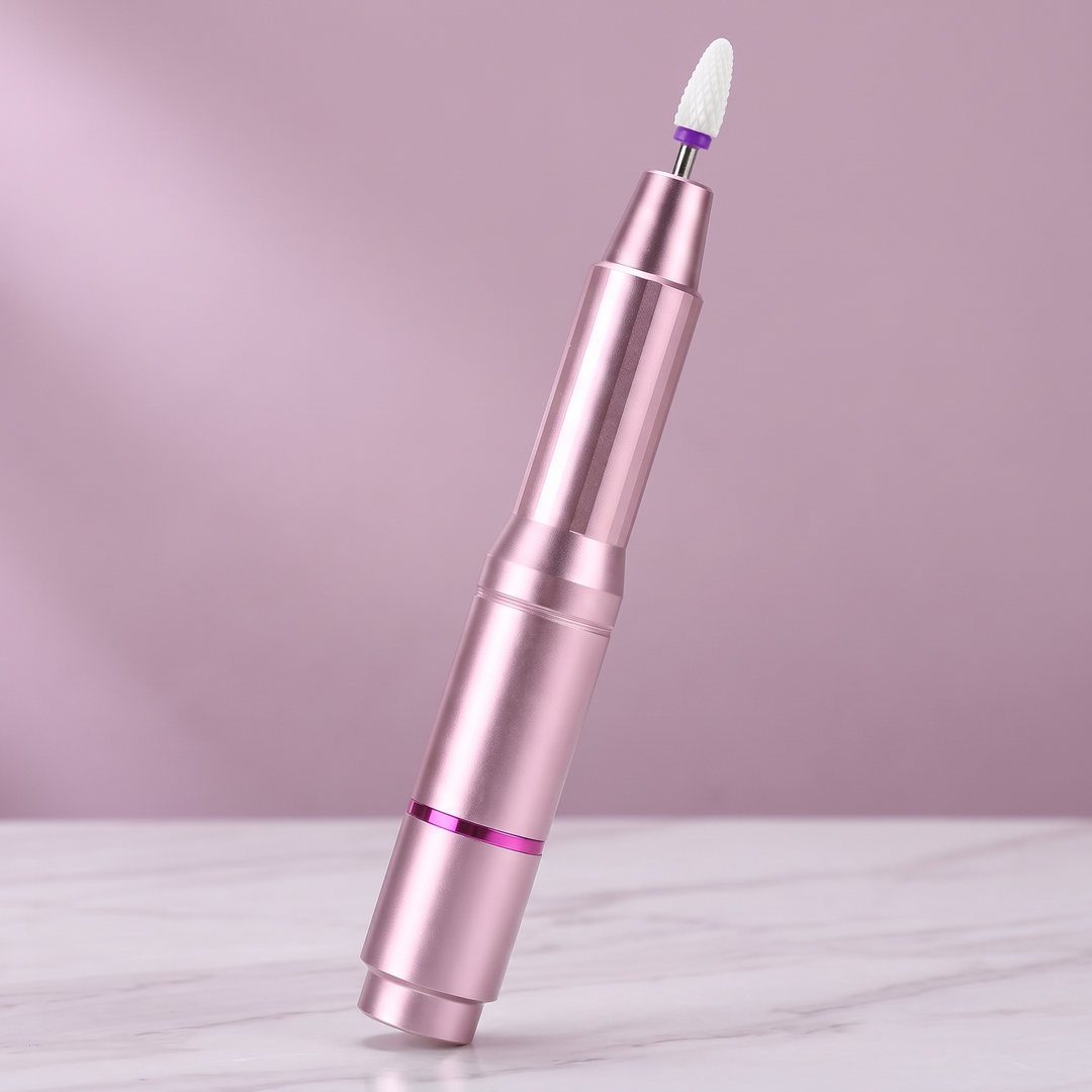 Rose Gold pen-style electric nail drill with a bit fitted