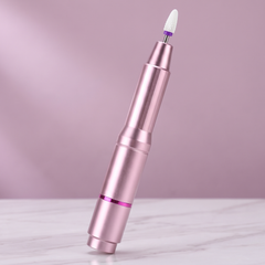Rose Gold pen-style electric nail drill with a bit fitted