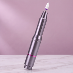 Grey pen-style electric nail drill with a bit fitted