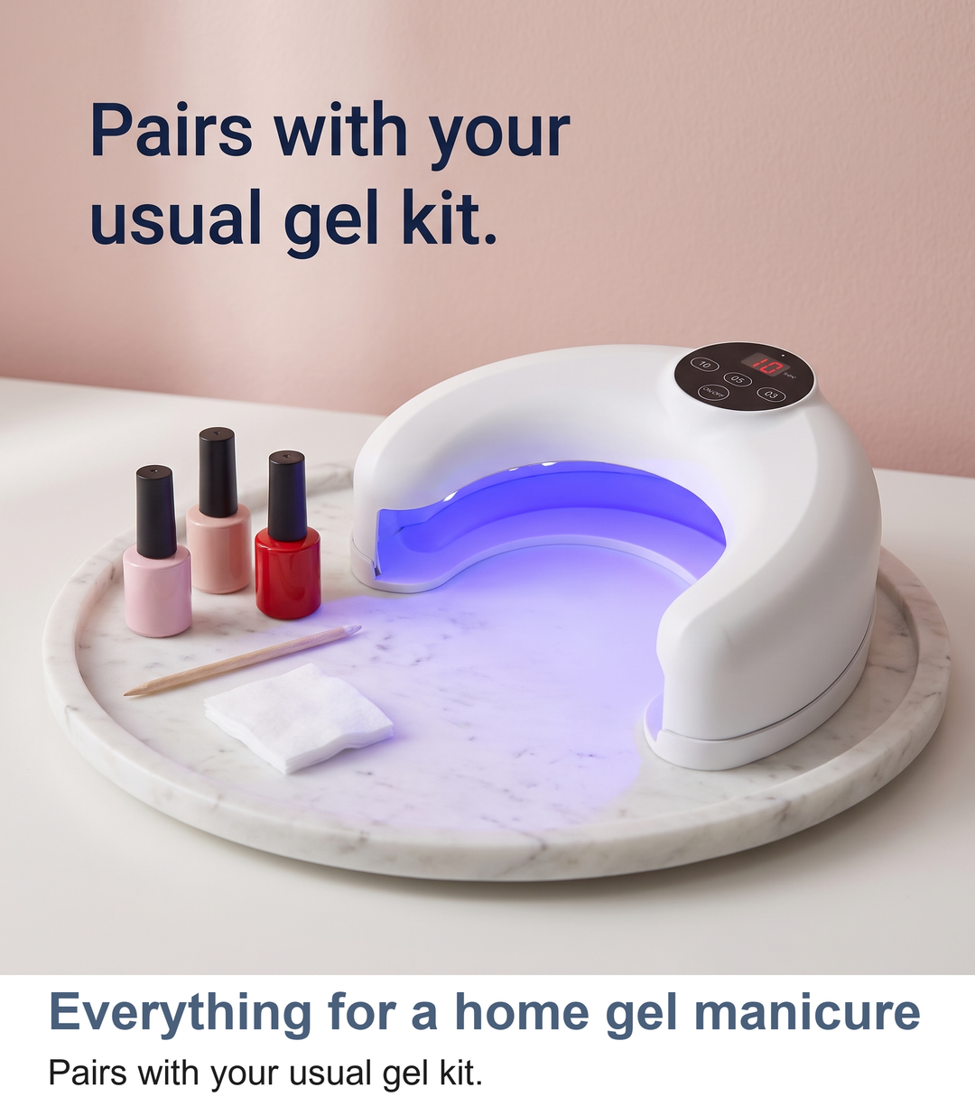 Crescent nail lamp beside a home gel manicure kit