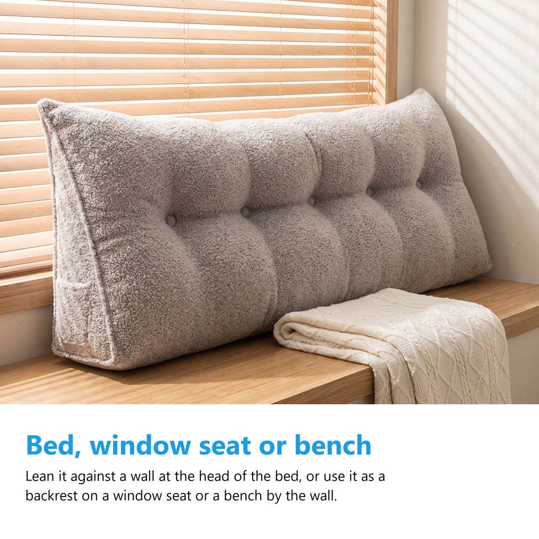Triangle bolster cushion used as a backrest on a window seat