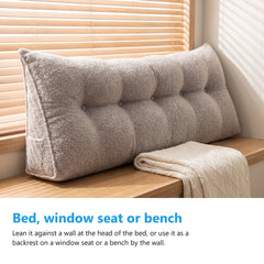 Triangle bolster cushion used as a backrest on a window seat