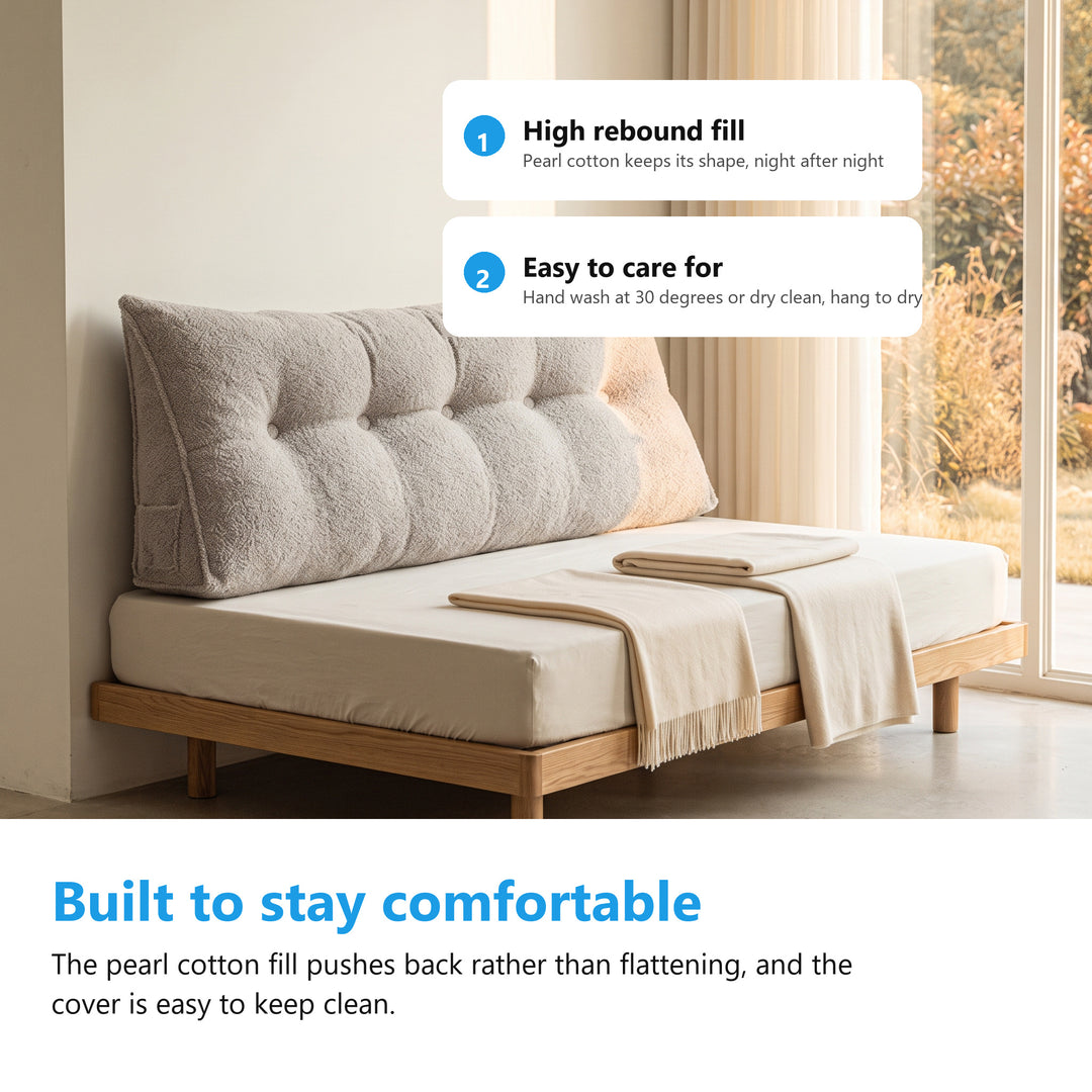 Headboard bolster cushion on a daybed in a bright living room corner