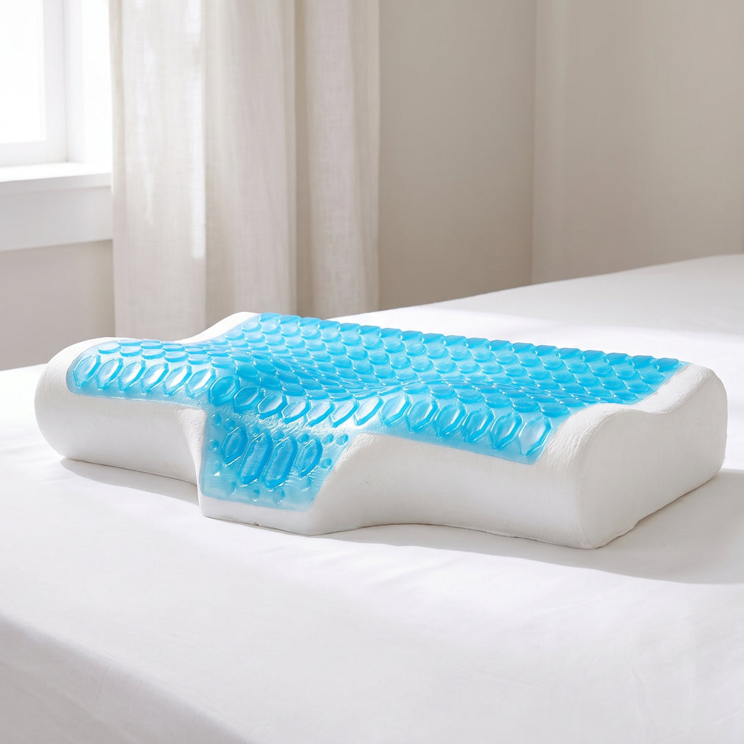 Cooling gel pillow with a blue dimpled gel plate on a white butterfly contour memory foam core, sitting on a made bed in a bright bedroom