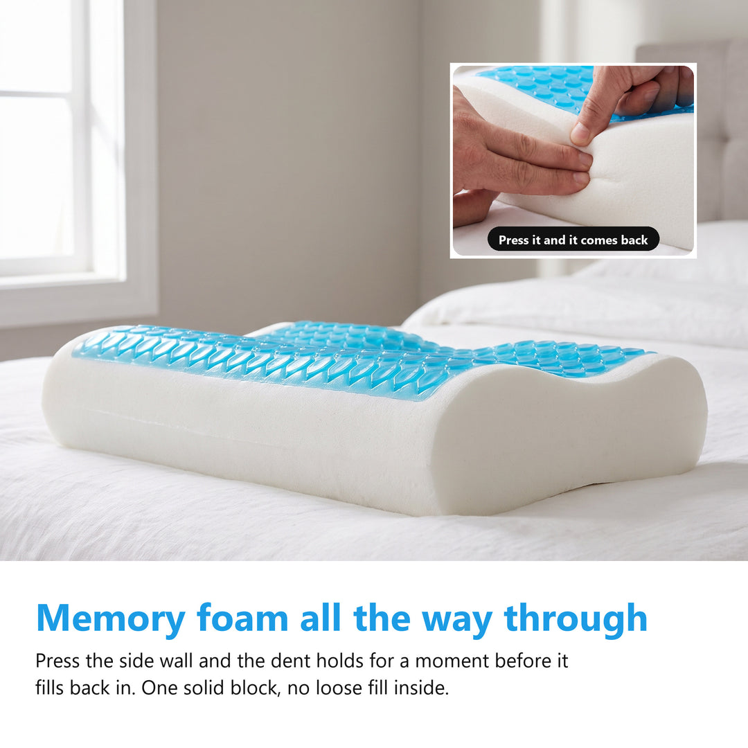 White memory foam body of a cooling gel pillow on a bed with a hand pressing a dent into the side wall