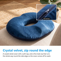 Navy donut cushion on a linen armchair with a close up of the track zip that runs round the side edge