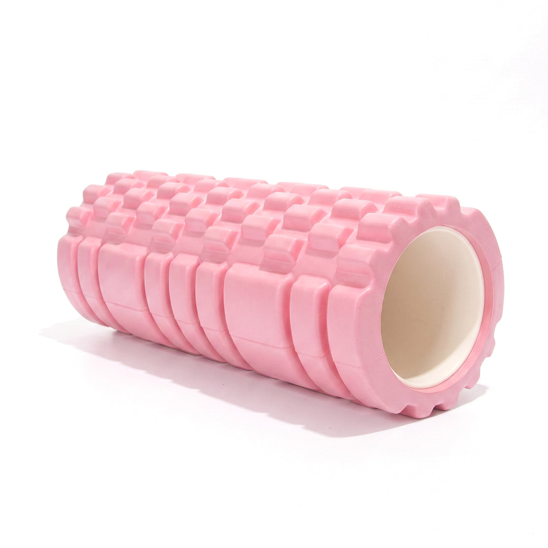 Pink textured foam roller with a raised grid surface on a white background