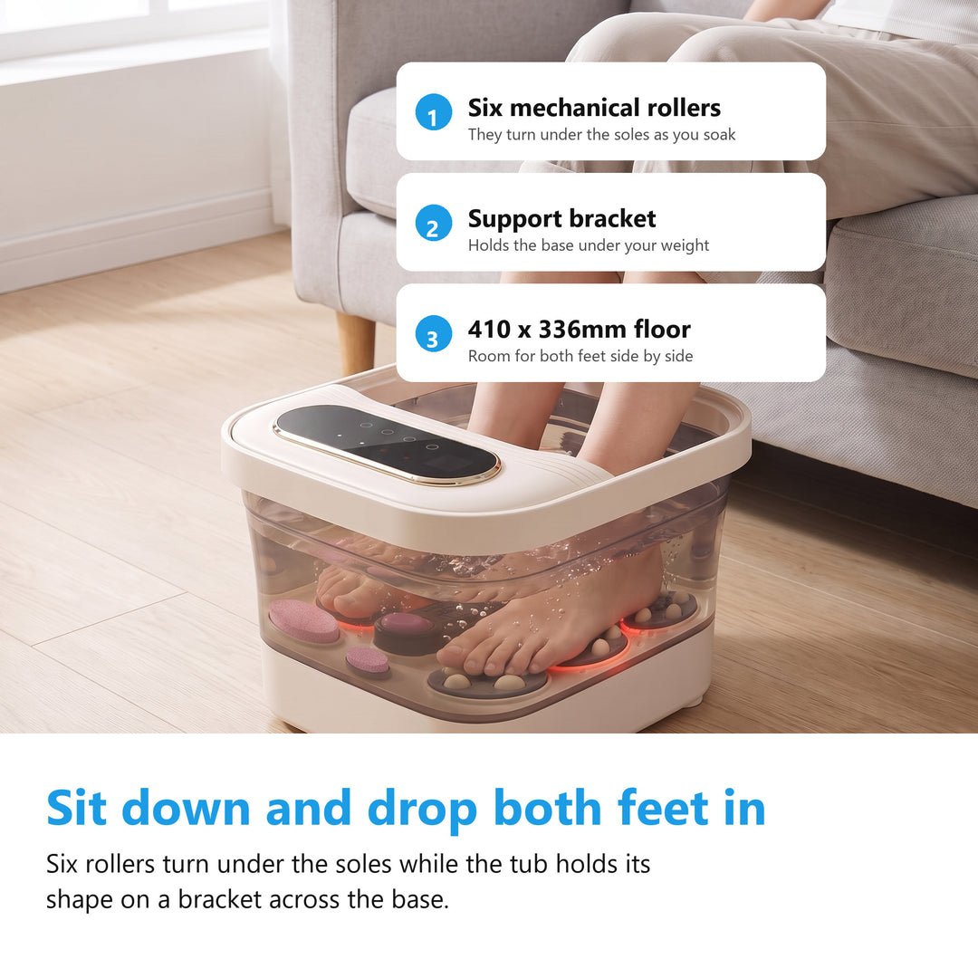 Woman sitting on a sofa with both feet soaking in the foot spa bath massager