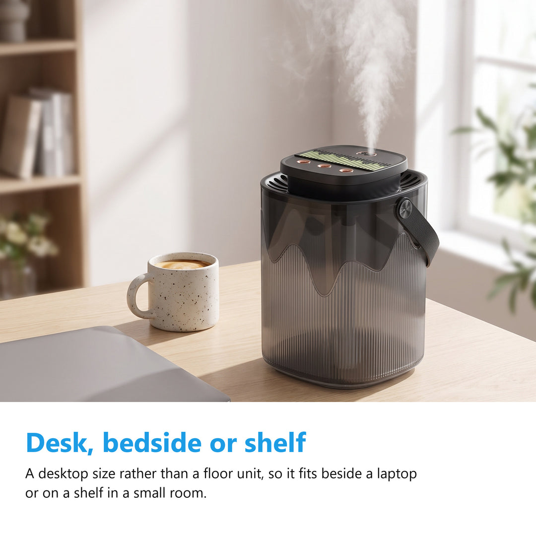 Air humidifier on a desk beside a laptop and a mug