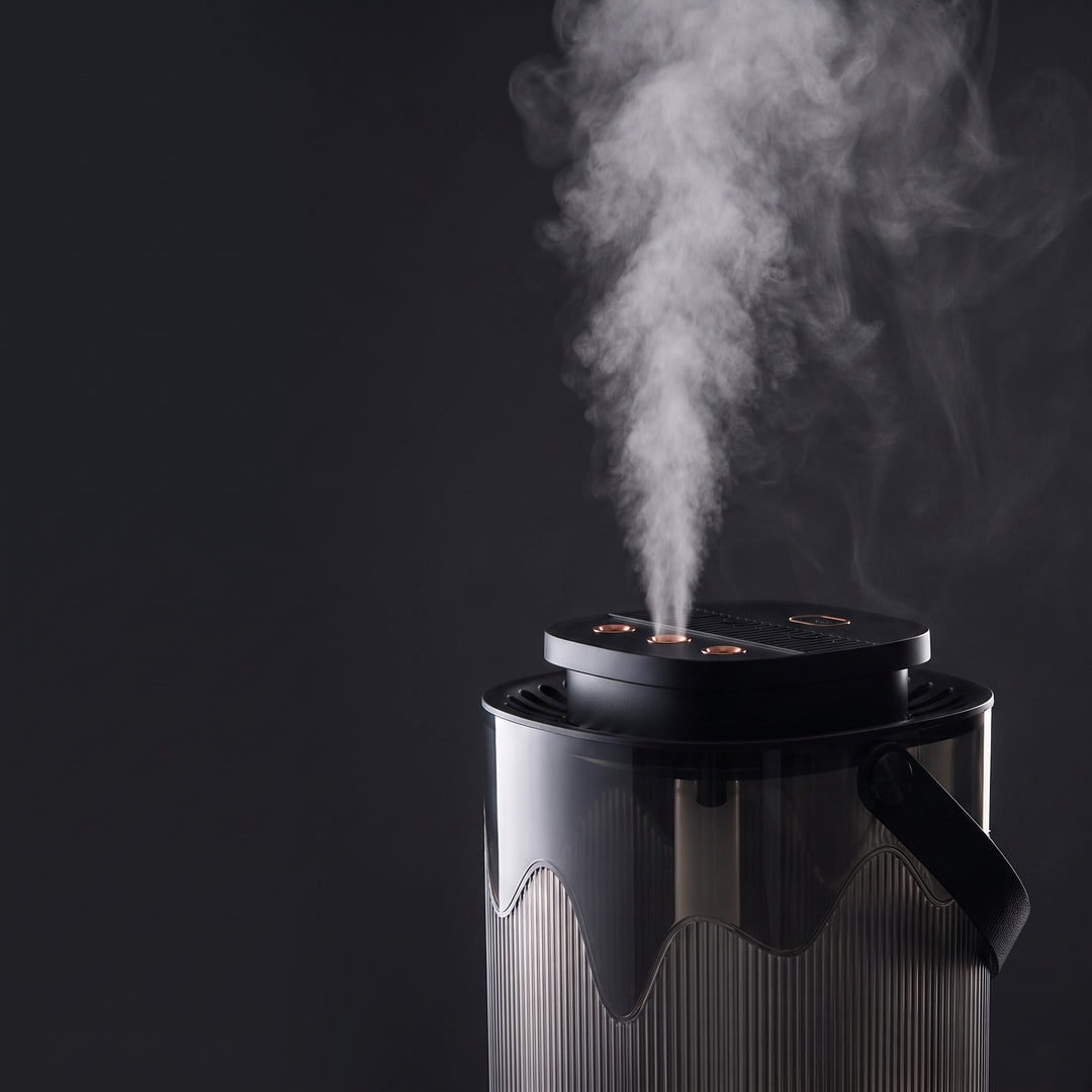 Cool mist rising from the three nozzles of the humidifier