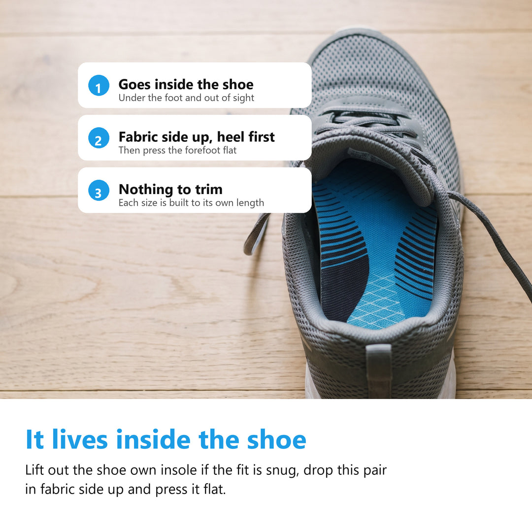 Blue arch support insole fitted inside a grey lace up trainer