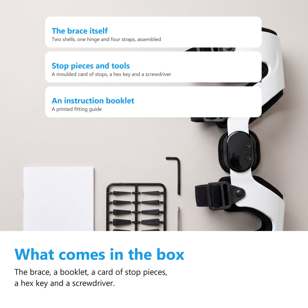 Flat lay of the white hinged knee brace with a booklet, a card of moulded stop pieces, a hex key and a screwdriver