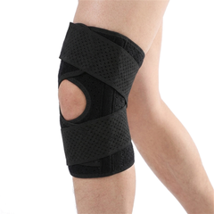 Cycling sports knee pad in black on the right knee, open patella wrap