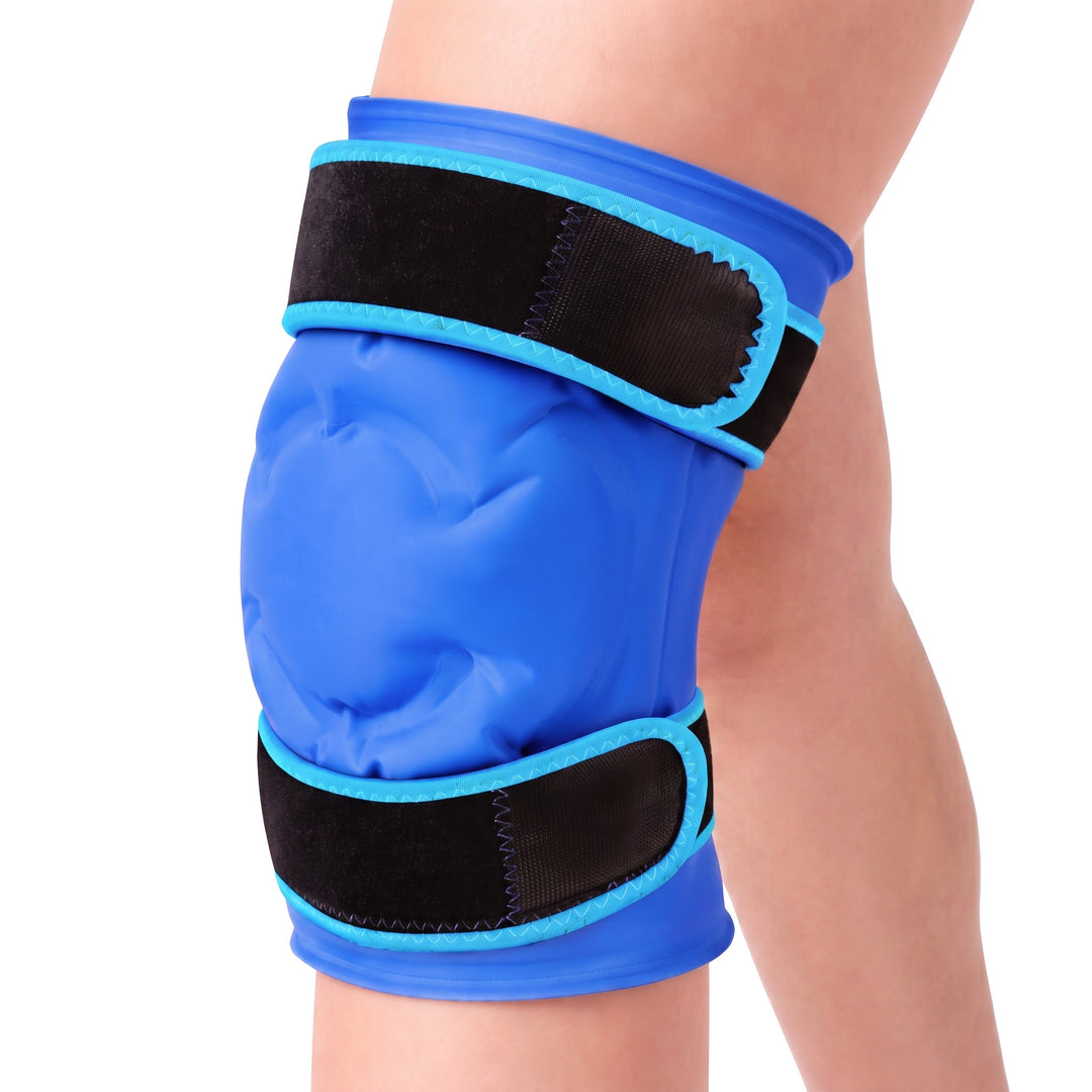 Navy blue knee ice pack gel sleeve worn on a knee against a white background, the padded front panel and both black straps in view